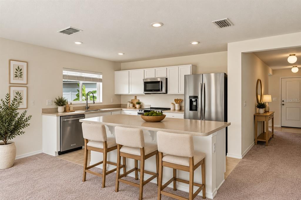 This is a floor plan for a single-story residential home with three bedrooms and a garage — 1444 MATTIE POINTE LANE, AUBURNDALE, FL