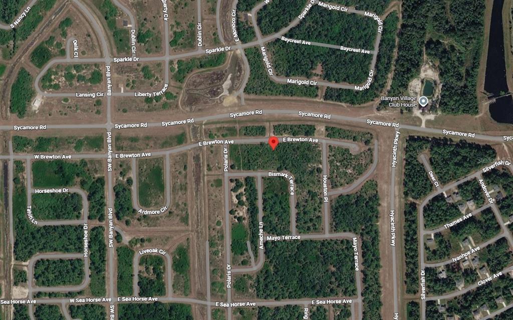 This is a satellite map view of a residential neighborhood with streets and wooded lots — 133 APOLLO AVENUE, LABELLE, FL