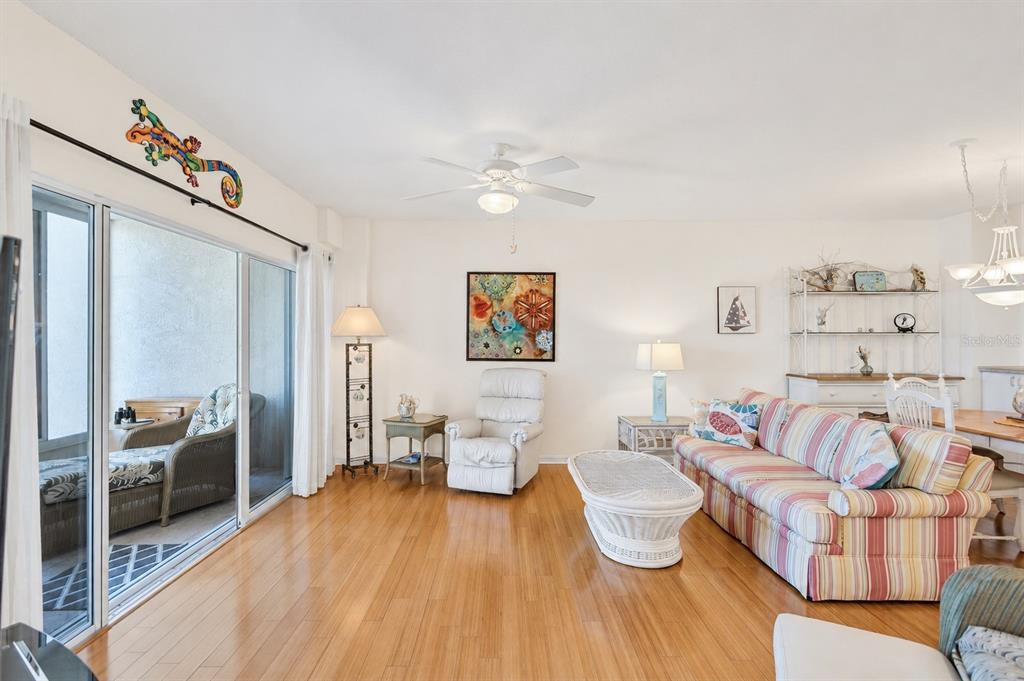 A tiled entryway leads past a closet and kitchen toward a living area with balcony access — 6475 SHORELINE DRIVE UNIT 5102, ST PETERSBURG, FL