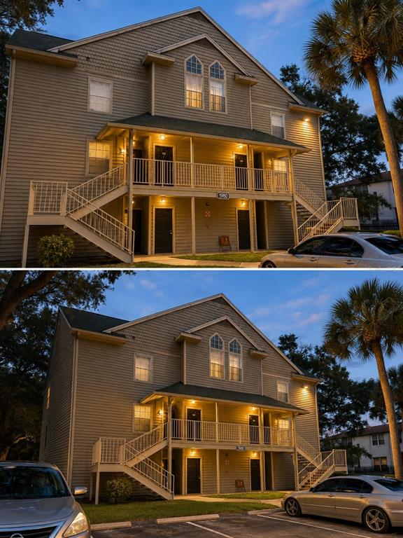 A two-story apartment building exterior features tan siding, a covered balcony, and outdoor staircases — 5980 WESTGATE DRIVE UNIT 201, ORLANDO, FL