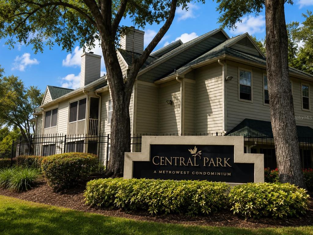A sign for Central Park at Metrowest Condominium stands before a multi-story beige apartment building — 5980 WESTGATE DRIVE UNIT 201, ORLANDO, FL
