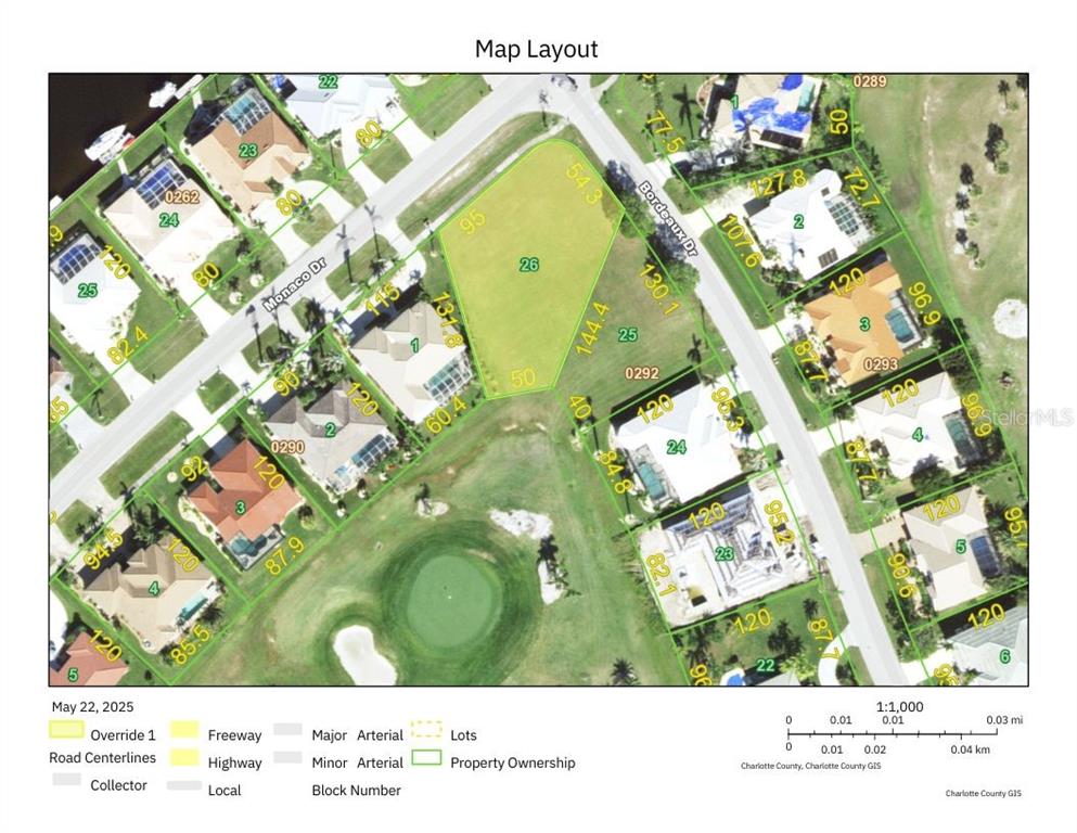 A vacant, grassy residential lot sits adjacent to a concrete sidewalk and neighboring houses — 3701 BORDEAUX DRIVE, PUNTA GORDA, FL