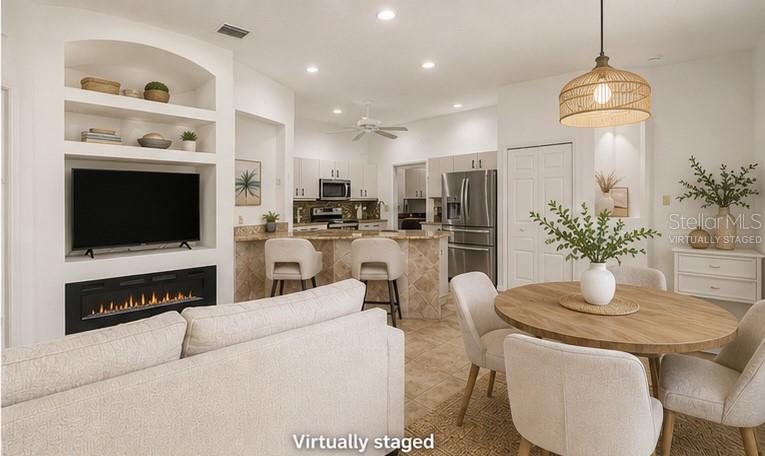A single-story house with a two-car garage, palm trees, and a landscaped front yard — 1754 TRIBUTORY LN, PORT ORANGE, FL