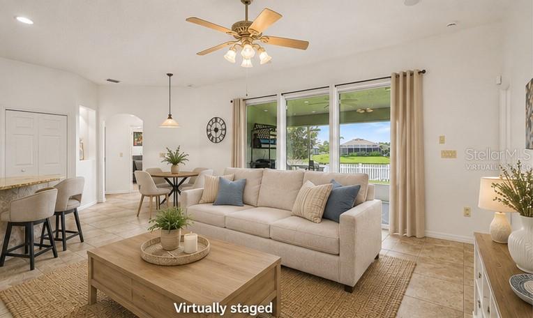 A single-story house with a two-car garage and palm trees in the front yard — 1754 TRIBUTORY LN, PORT ORANGE, FL