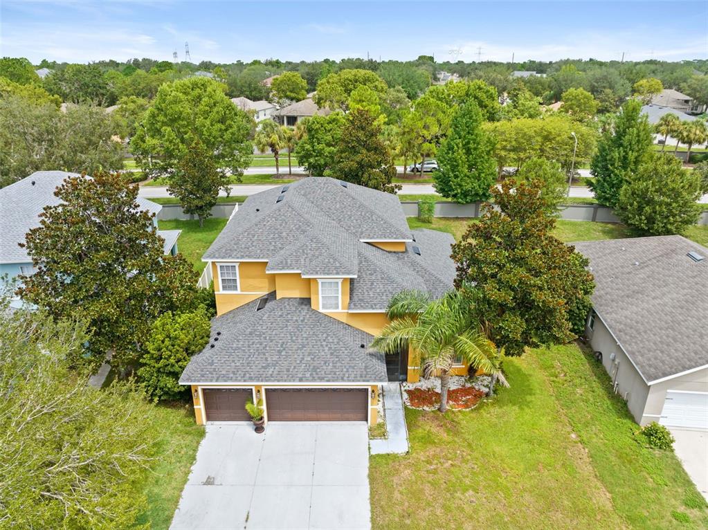 An aerial view of a two-story house with a shingled roof and a two-car garage — 4501 BIRCHFIELD LOOP, SPRING HILL, FL
