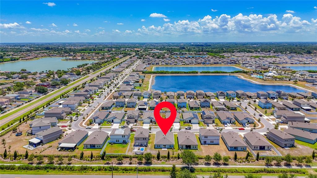 An aerial view shows a suburban neighborhood with a red location pin over a house — 1349 ANCHOR BEND DRIVE, RUSKIN, FL