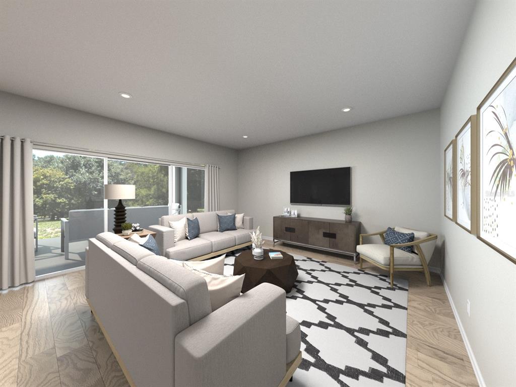 This is a digital rendering of a living room featuring a sofa, television, and rug — 405 BROOKHAVEN TRAIL, ORMOND BEACH, FL