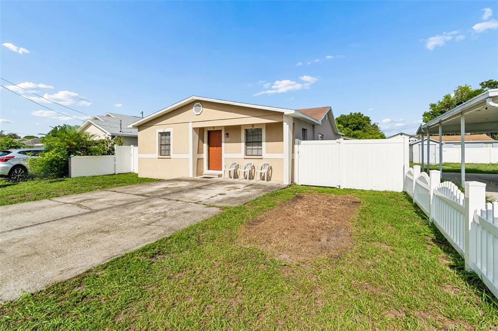 A single-story house with a concrete driveway and a mailbox in the front yard — 5120 N MATANZAS AVENUE, TAMPA, FL