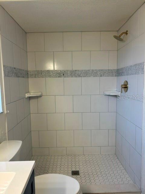 An empty room features dark wood-look flooring, white walls with chair rail molding, and vertical blinds — 1060 E NORMANDY BOULEVARD, DELTONA, FL