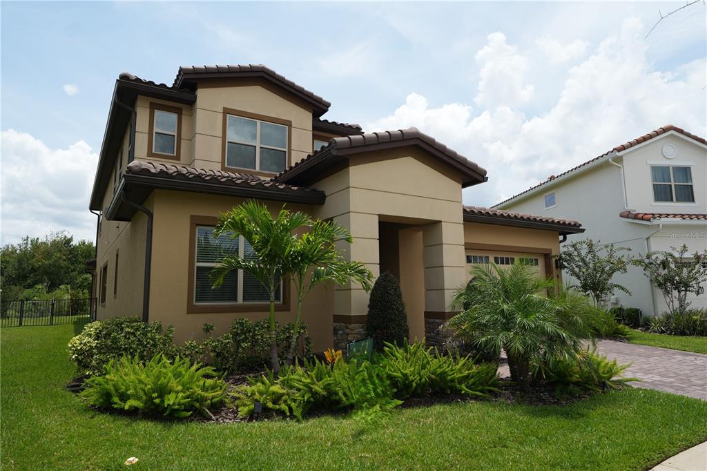 A two-story house with a covered patio, swimming pool, and large backyard — 8112 CLEOBURY DRIVE, ORLANDO, FL