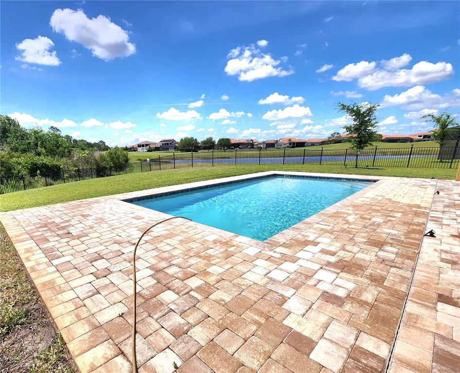 An aerial view of a two-story house with a tile roof and a paved driveway — 8112 CLEOBURY DRIVE, ORLANDO, FL