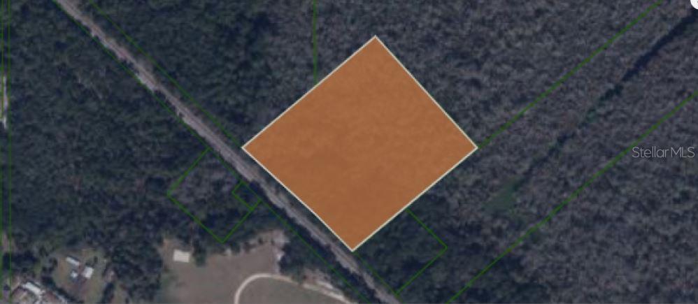 An aerial map view shows a square-shaped parcel of land highlighted in brown — N/A, EAST PALATKA, FL