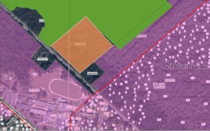 This is a map showing a highlighted orange land parcel surrounded by green and purple areas — N/A, EAST PALATKA, FL
