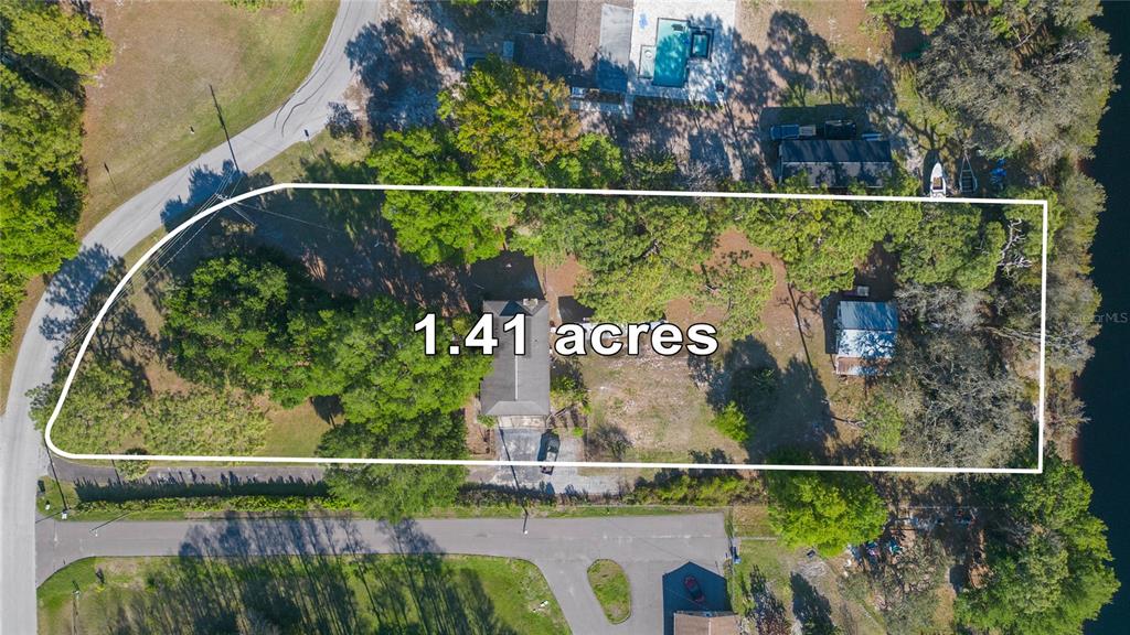 This aerial view shows a residential property lot marked as 1.41 acres — 17616 EAGLE LANE, LUTZ, FL