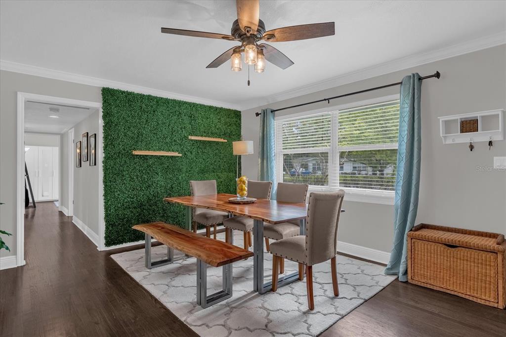 A single-story white house with a garage and a front lawn under a blue sky — 950 HANOVER AVENUE, WINTER PARK, FL