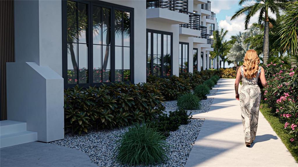 An aerial view shows a multi-unit residential complex situated along a coastal road — 2360 OCEAN SHORE BOULEVARD UNIT 403, ORMOND BEACH, FL