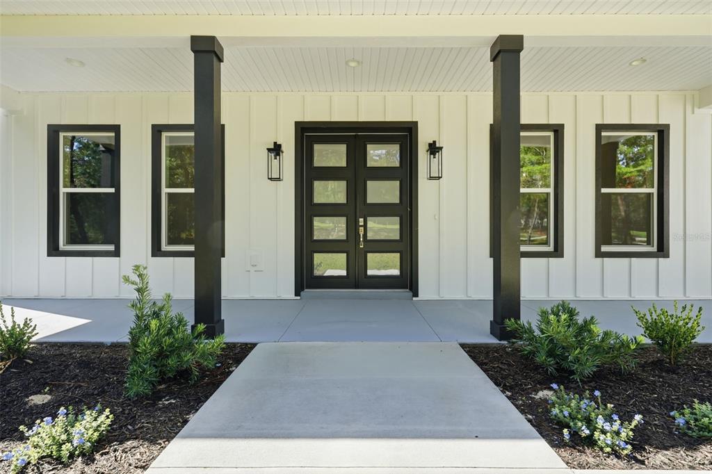 This image is a graphic rendering displaying an exterior color palette for a home — 2207 COUNTY ROAD 243E, WILDWOOD, FL