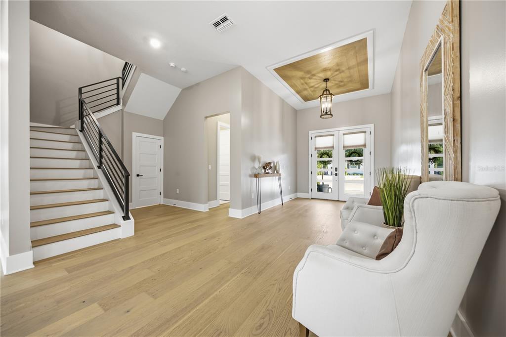 A two-story white modern farmhouse with a two-car garage and a paved driveway — 4022 W BAY TO BAY BOULEVARD, TAMPA, FL