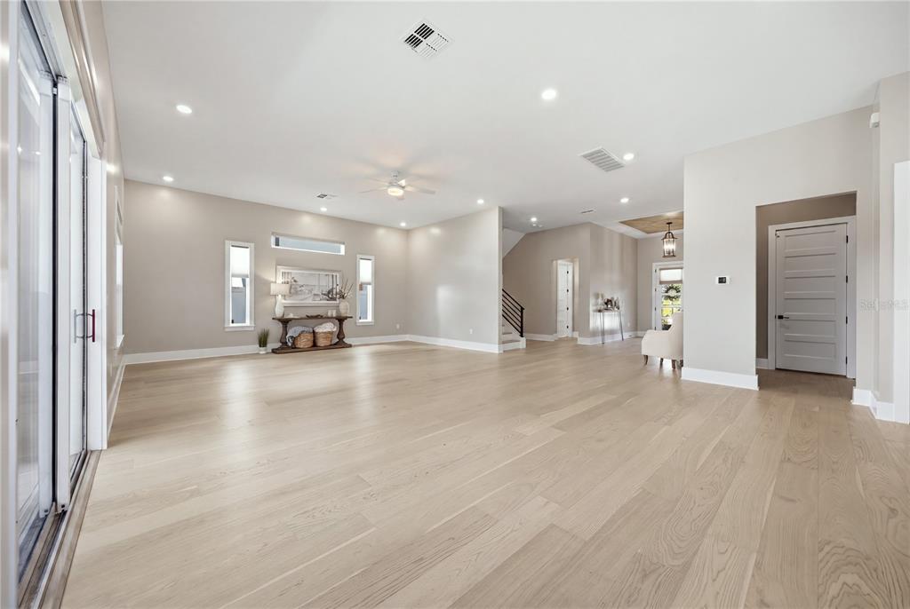 An entryway features a patterned rug, a wooden bench, a chest, and a tray ceiling — 4022 W BAY TO BAY BOULEVARD, TAMPA, FL