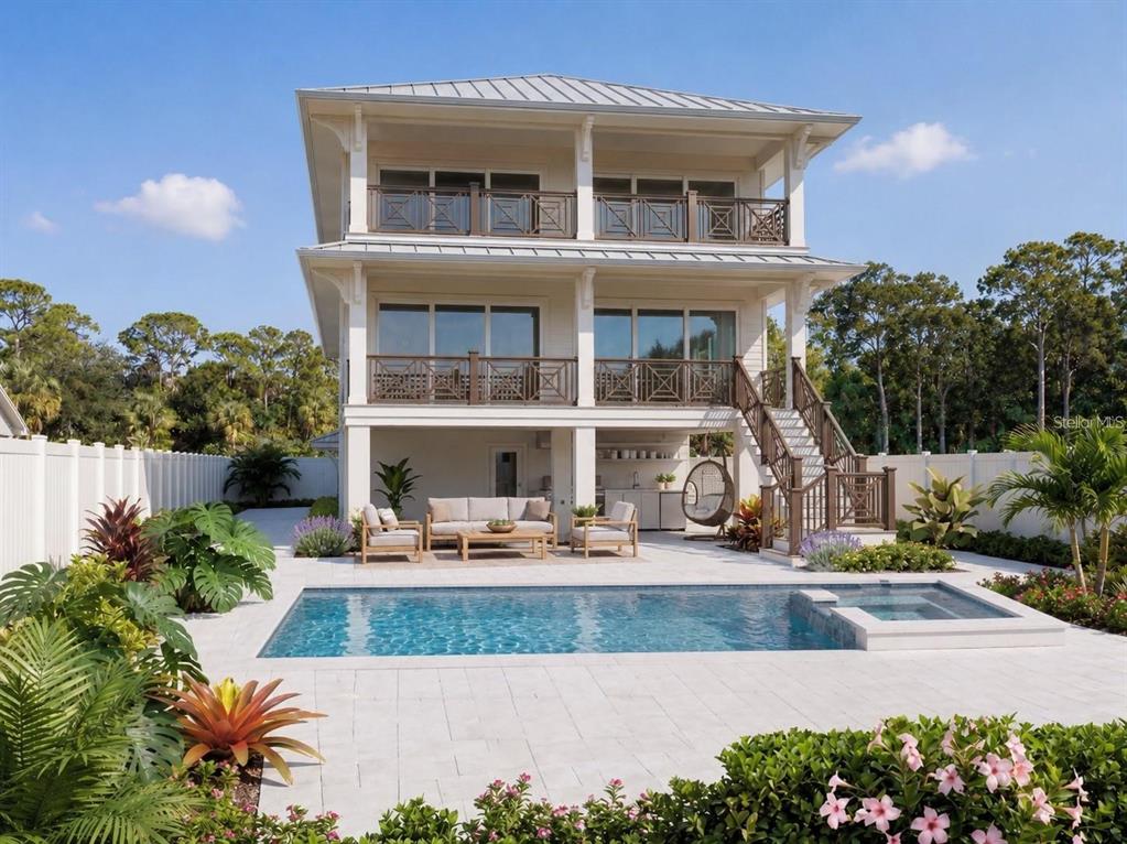 A three-story house with balconies overlooks a backyard patio featuring a swimming pool and spa — 4185 ROBERTS POINT CIRCLE, SARASOTA, FL