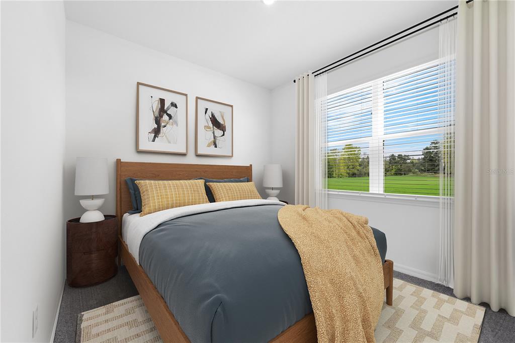 A bedroom features a wooden bed frame, blue bedding, yellow accents, and a large window — 1075 CONNOLLY LANE, PALM BAY, FL