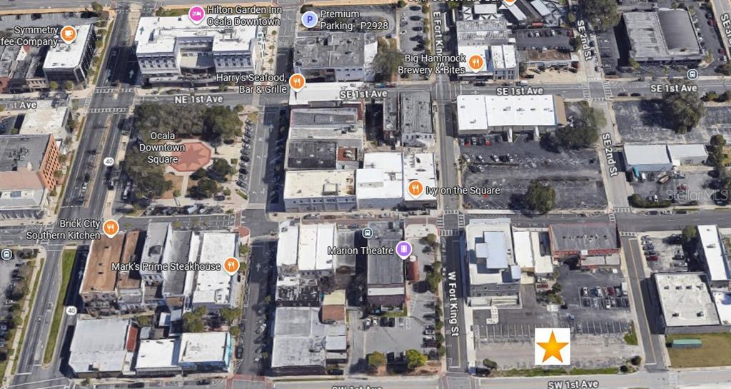This is an aerial map view of a downtown city block with a gold star — 94 SW FT KING, OCALA, FL