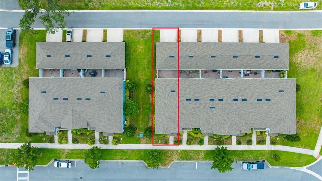 An aerial view shows two rows of townhomes with a red outline highlighting one unit — 14478 PROMENADE, ODESSA, FL