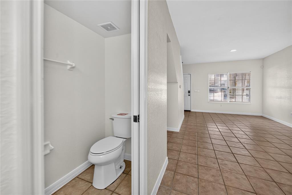 A carpeted staircase leads upward between a white railing and a beige wall — 4214 PLANTATION COVE DRIVE, ORLANDO, FL
