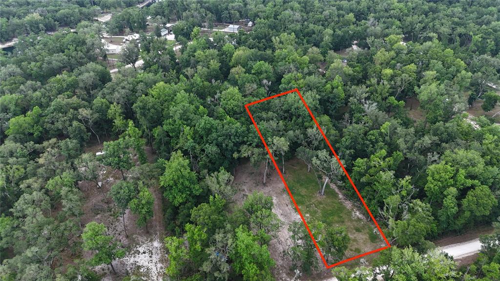 An aerial view shows a rectangular plot of cleared land surrounded by dense forest — TBD 292ND ST, BRANFORD, FL