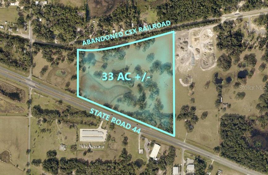 An aerial map shows a 33-acre parcel of land bordered by a railroad and highway — 1315 SR 44, LEESBURG, FL