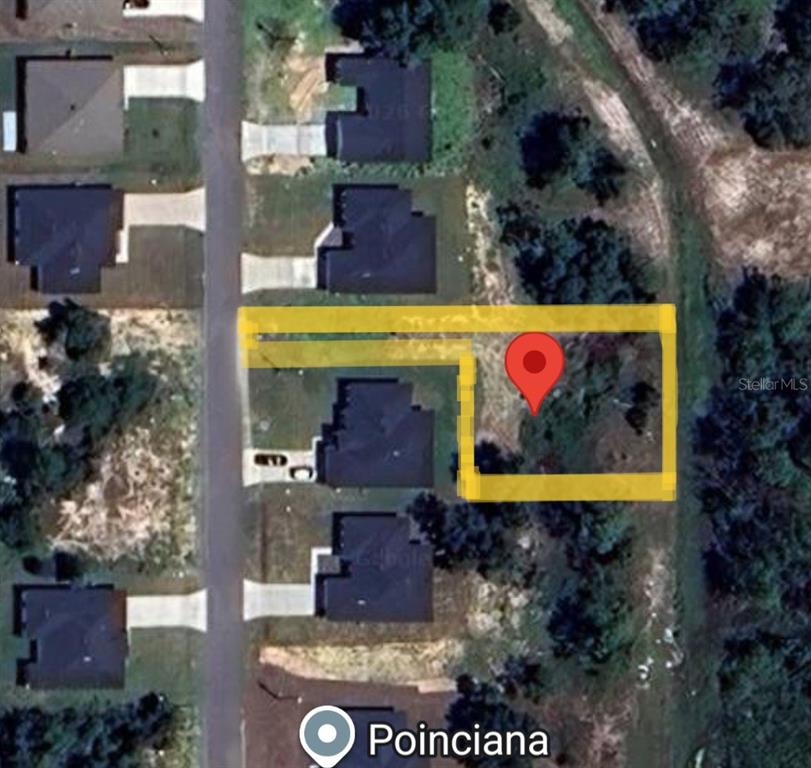 This aerial map shows a vacant residential lot outlined in yellow with a red location pin — 1311 CONGO DRIVE, POINCIANA, FL