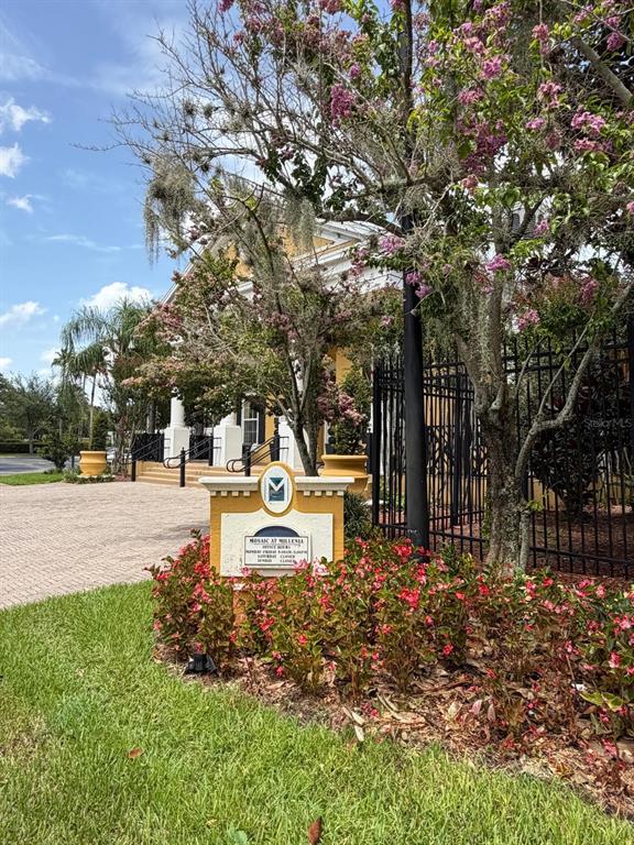 A sign for Mosaic at Millenia stands in front of a building with a black fence — 3621 CONROY ROAD UNIT 720, ORLANDO, FL
