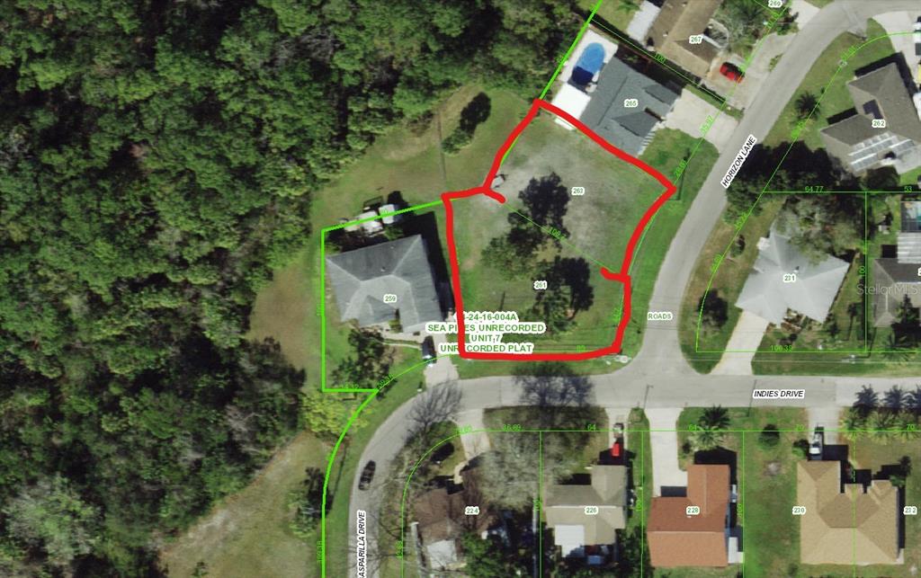 This is an aerial map showing a vacant lot outlined in red — INDIES DRIVE, HUDSON, FL