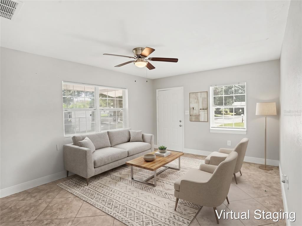 An empty room with light gray walls, tile flooring, and a ceiling fan — 4514 DREXEL AVENUE, ORLANDO, FL
