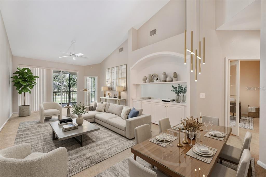 A bright, open-concept living and dining area features vaulted ceilings, neutral decor, and modern lighting — 411 ENCLAVE PLACE UNIT 411, LAKELAND, FL