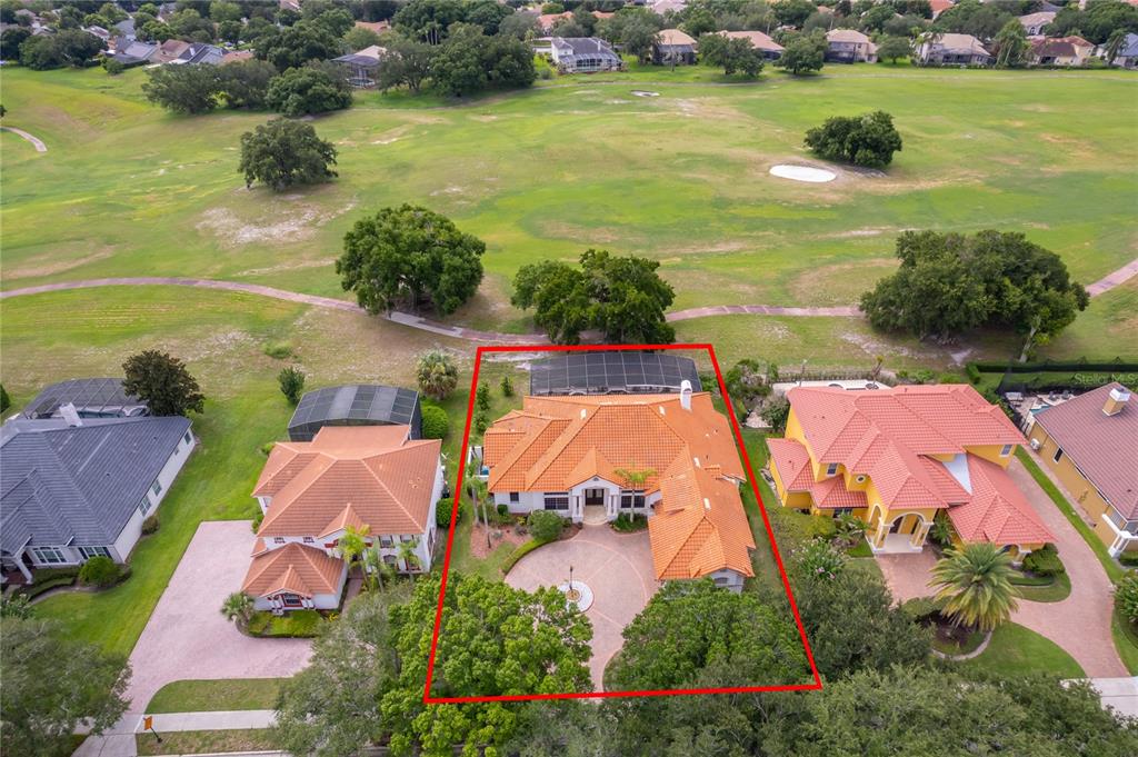 An aerial view shows a house with a terracotta tile roof and a circular driveway — 2313 ROAT DRIVE, ORLANDO, FL