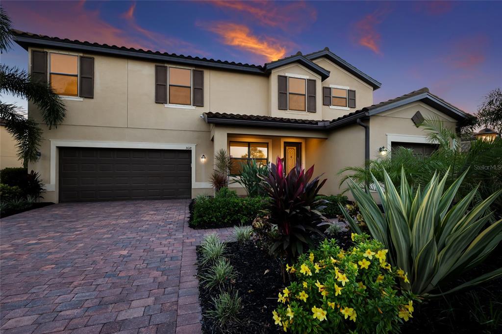 A two-story suburban house with a paved driveway, a garage, and landscaped front yard — 3618 SCRUB CREEK RUN, LAKEWOOD RANCH, FL
