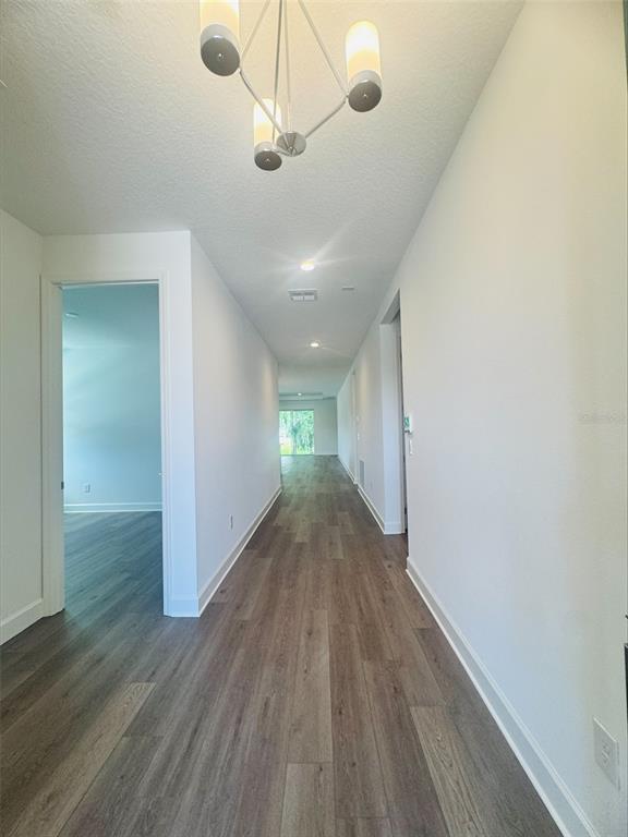 This interior design selection board displays paint, doors, hardware, flooring, and lighting fixture samples — 3678 ARBORDALE LOOP, SANFORD, FL
