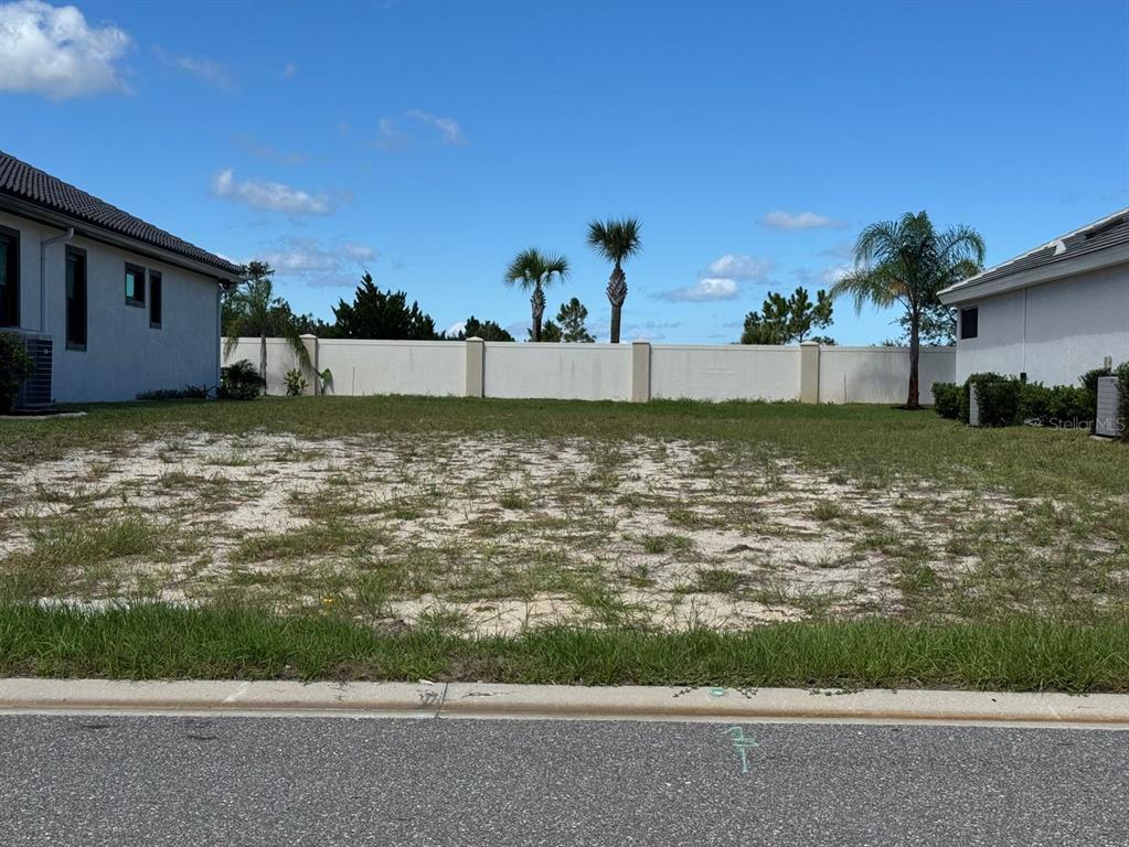 An aerial view shows a community clubhouse, pool, boat docks, and a large storage building — 34 DEL PALMA DRIVE, PALM COAST, FL
