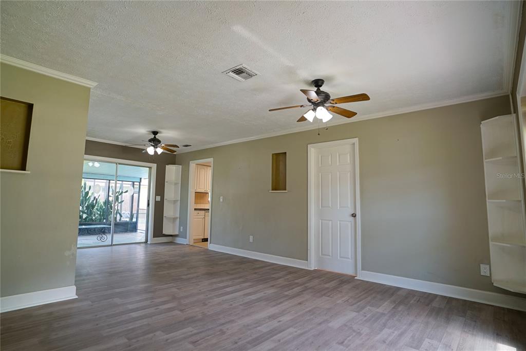 A bathroom features a walk-in shower with marble-look tile, a gray vanity, and a toilet — 3320 LAS BRISAS DRIVE, RIVERVIEW, FL