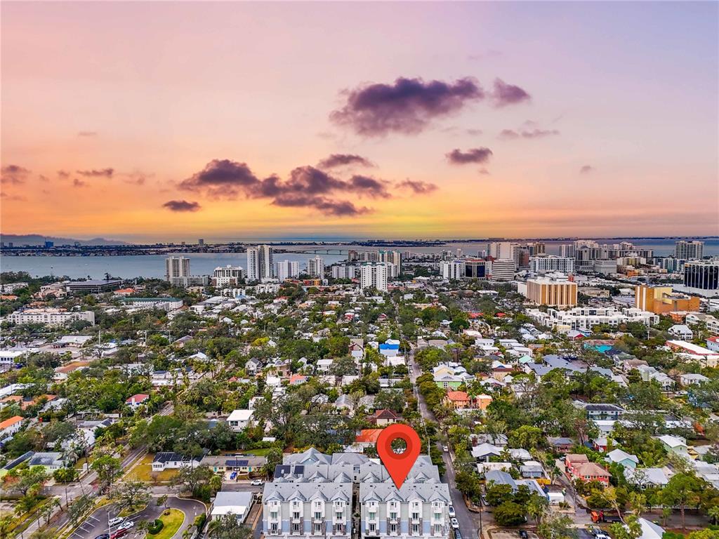 An aerial view shows a residential neighborhood with a red location pin over townhomes — 506 LAUREL PARK DRIVE UNIT 506, SARASOTA, FL