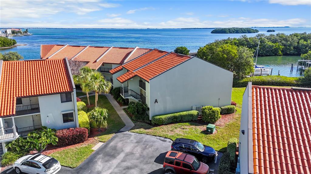 A view of a calm bay with small islands under a blue sky with clouds — 1515 PINELLAS BAYWAY S UNIT 7, TIERRA VERDE, FL