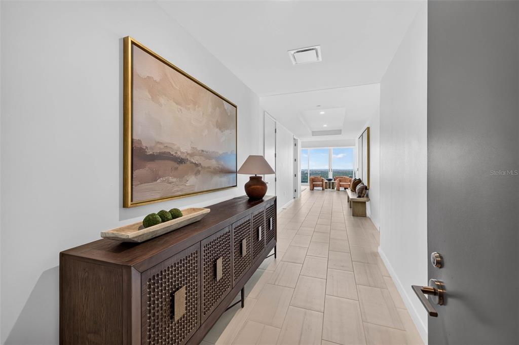 A modern open-concept living room and kitchen with floor-to-ceiling windows and a balcony — 400 CENTRAL AVENUE UNIT 3401, ST PETERSBURG, FL