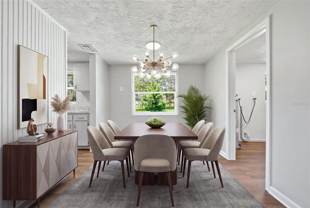 A dining room features a wooden table, six upholstered chairs, a chandelier, and a sideboard — 52 S JEFFERSON STREET, BEVERLY HILLS, FL