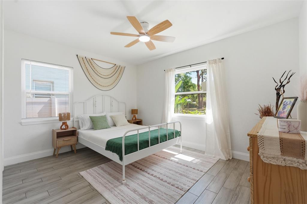 A single-story house with a light-colored exterior, a front porch, and a concrete driveway — 2855 VALENCIA WAY S, ST PETERSBURG, FL