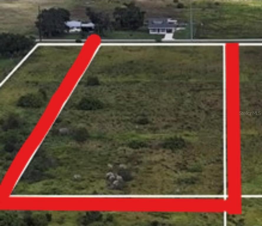 An aerial view shows a rectangular, undeveloped grassy lot outlined in red — METHENY RD, PARCEL B, WAUCHULA, FL