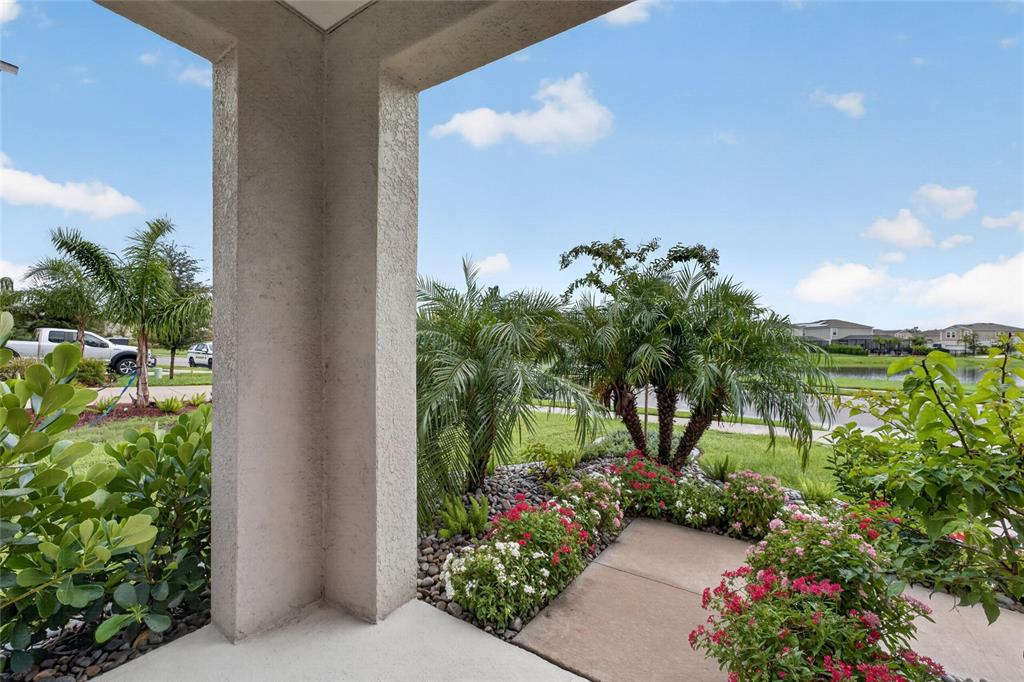 A two-story house with a concrete driveway, a two-car garage, and a landscaped front yard — 7723 DEPOT LOOP, PARRISH, FL