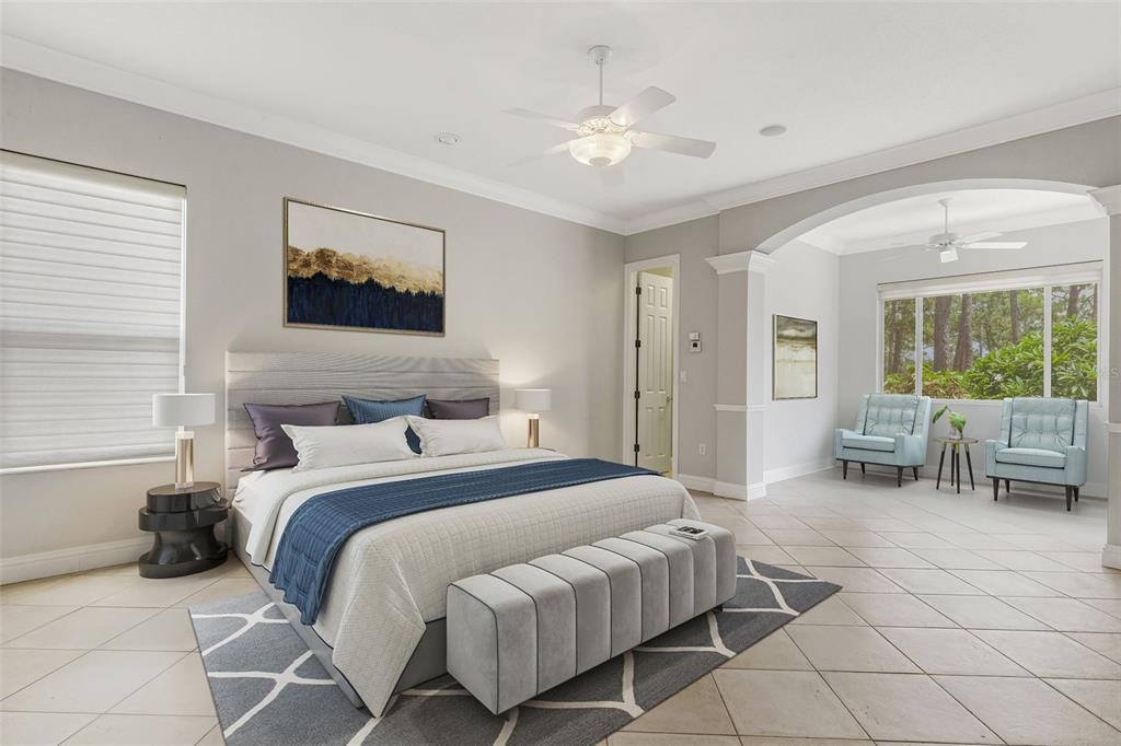 A spacious bedroom features a king bed, a sitting area, tile floors, and two ceiling fans — 299 TURQUOISE LANE, OSPREY, FL