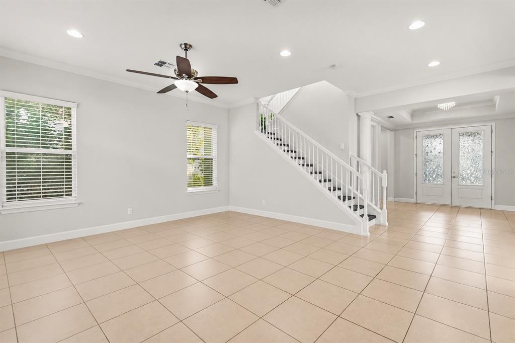 An aerial view shows a house roof with multiple solar panel arrays and a patio — 12837 BOVET AVENUE, ORLANDO, FL
