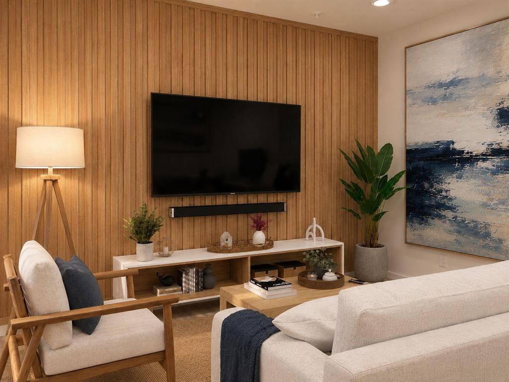 A living room features a wood-slat accent wall, a wall-mounted television, and modern furniture — 131 TESSIE LANE, SANFORD, FL